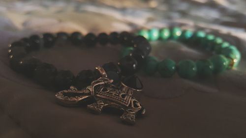 Close-up of necklace on table