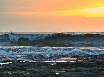 Scenic view of sea against sky during sunset