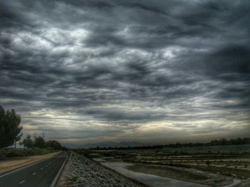 Storm clouds over road