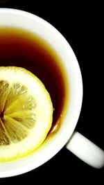 Close-up of drink on black background