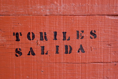 Close-up of text on brick wall