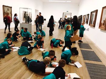 High angle view of people sitting on floor