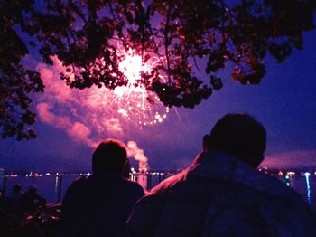 Silhouette people standing at night