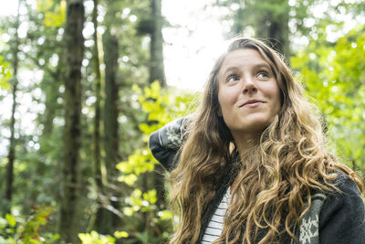 Portrait of teenage girl in woods near clayton beach