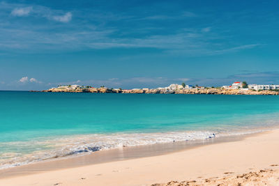 Scenic view of sea against blue sky