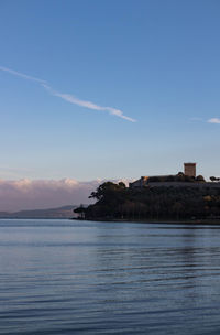 Scenic view of sea and building against sky