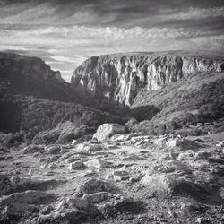 Scenic view of rock formations against sky