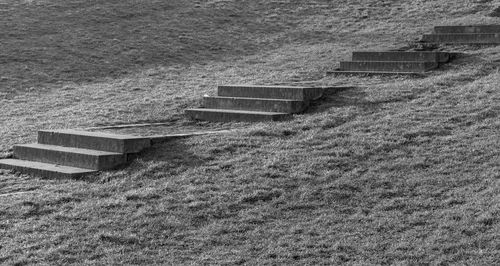 High angle view of bench on field