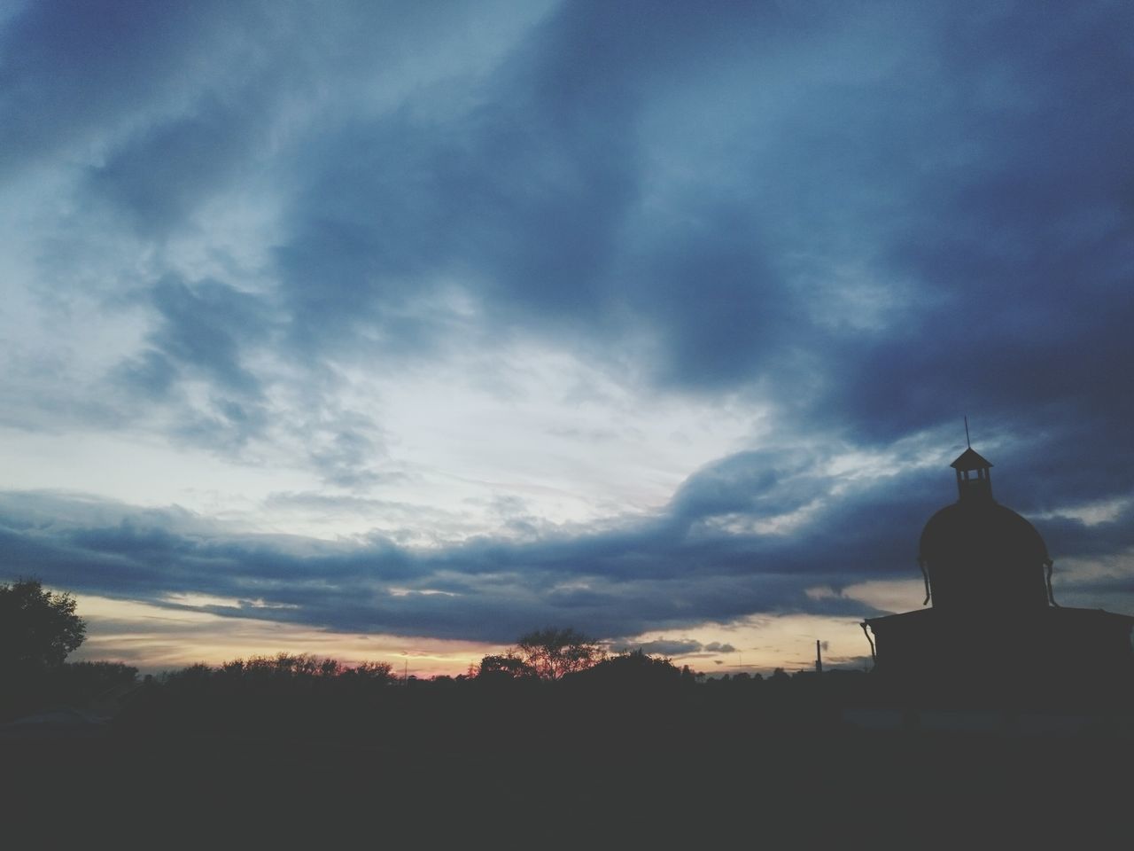 silhouette, sky, sunset, cloud - sky, built structure, architecture, building exterior, low angle view, dusk, cloud, cloudy, nature, outdoors, tree, tranquility, beauty in nature, scenics, no people, tranquil scene, outline