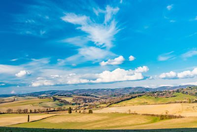 Scenic view of landscape against blue sky