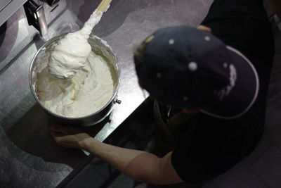 High angle view of hand holding ice cream