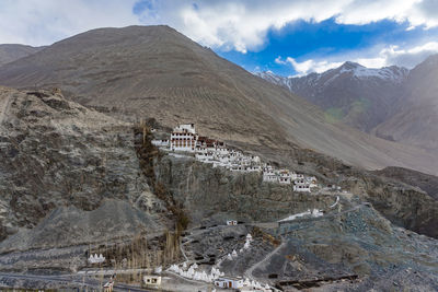 Panoramic view of mountain range against cloudy sky