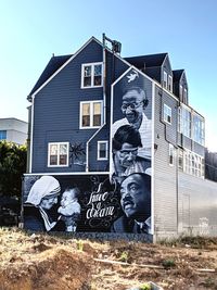 Graffiti on building against clear sky