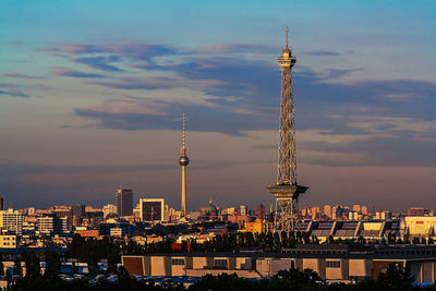 Cityscape against sky at sunset