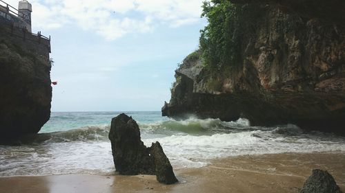 Scenic view of sea against cloudy sky