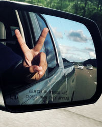 Close-up of man hand in car