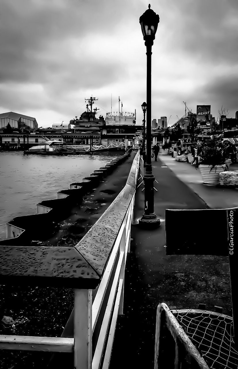 RIVER AMIDST BRIDGE AGAINST SKY