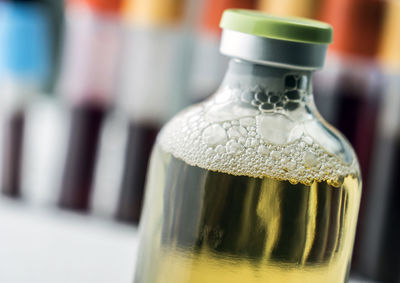 Close-up of glass bottle on table