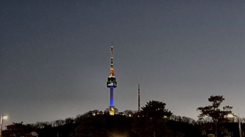 Low angle view of communications tower against sky