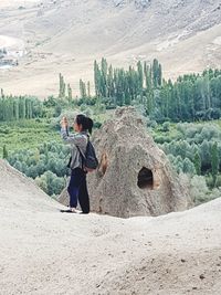 Full length of man standing on mountain