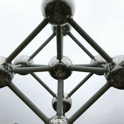 Low angle view of metallic structure against sky