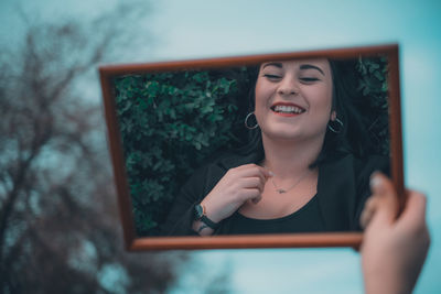 Portrait of young woman smiling