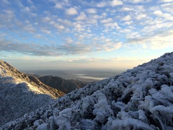 Scenic view of mountains against sky during winter