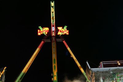 Low angle view of illuminated ferris wheel