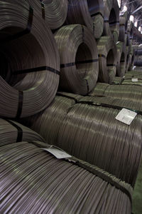 Full frame shot of metallic rolled up wires at steel plant