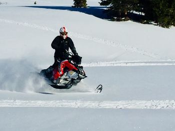 Man riding motorcycle on snow