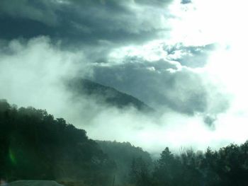 Scenic view of landscape against cloudy sky