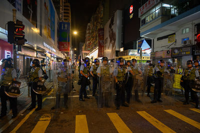 People on city street at night