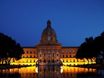View of building against clear sky at night