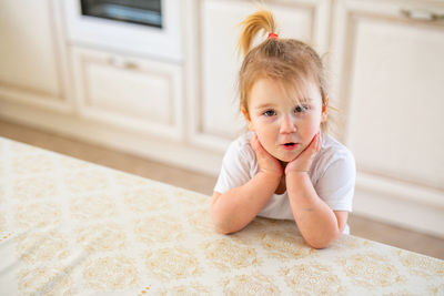 Cute girl looking away at home