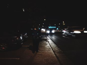 Cars on road in city at night