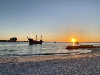 Scenic view of sea against clear sky during sunset