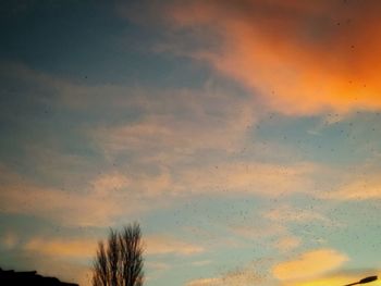 Low angle view of cloudy sky at sunset