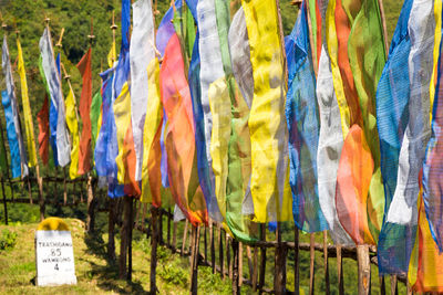 Close-up of multi colored umbrellas hanging in row