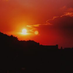 Scenic view of silhouette orange sky during sunset