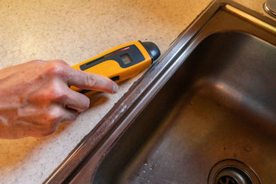 Close-up of man working in machine