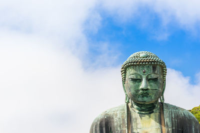 Low angle view of statue against sky