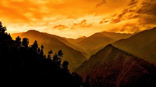 Scenic view of mountains against sky during sunset