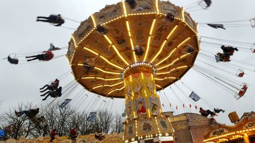 Low angle view of ferris wheel against sky