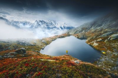 Scenic view of mountains against cloudy sky