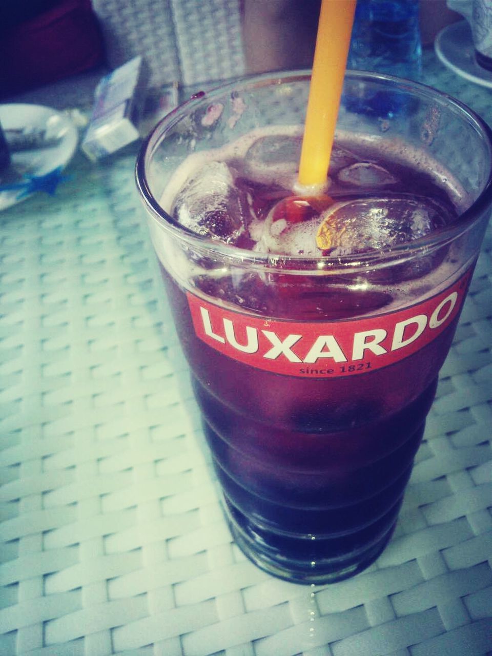 food and drink, drink, refreshment, freshness, drinking glass, indoors, still life, table, glass - material, close-up, glass, drinking straw, transparent, alcohol, red, focus on foreground, ice cube, healthy eating, no people, cocktail