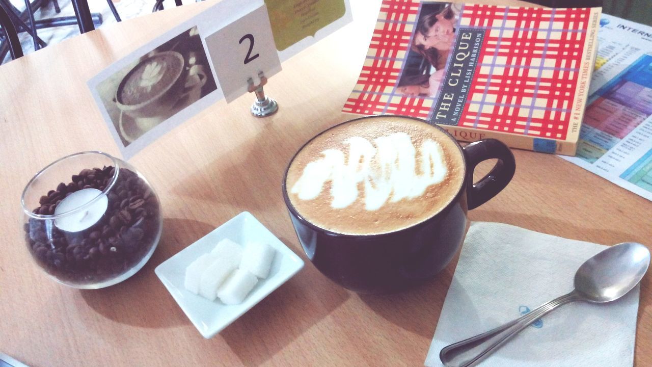 indoors, food and drink, table, drink, coffee cup, refreshment, coffee - drink, still life, high angle view, freshness, spoon, coffee, saucer, cup, plate, directly above, frothy drink, close-up, food, communication