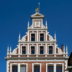 Low angle view of building against blue sky