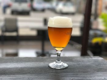 Close-up of beer glass on table