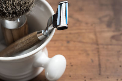 High angle view of shaving equipment on table