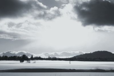 Scenic view of mountains against cloudy sky